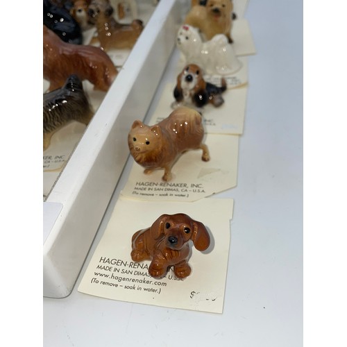 310 - SHELF OF HAGEN-RENAKER DOG AND HORSE FIGURE GROUPS