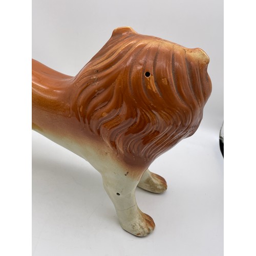 398 - 19TH CENTURY STAFFORDSHIRE FEROCIOUS LION FIGURE A/F 24cm x 33cm