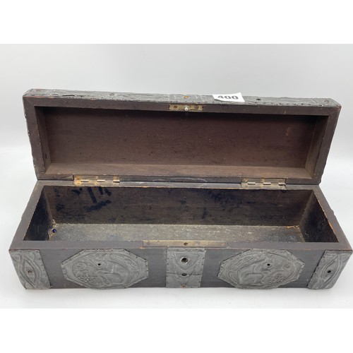 400 - ARTS AND CRAFTS OBLONG BOX WITH APPLIED PEWTER STRAP WORK AND WILLIAM MORRIS STYLE PANELS AND CABOCH... 