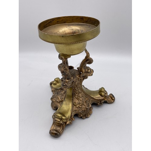 432 - REGENCY STYLE GILT METAL DOLPHIN ON TRIFORM BASE 15.5cm