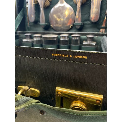 541 - MOROCCAN GREEN LEATHER TRAVELLING VANITY CASE BY WALKER AND HALL FITTED WITH SILVER TOPPED BOTTLES A... 