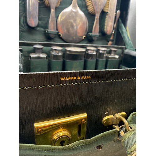 541 - MOROCCAN GREEN LEATHER TRAVELLING VANITY CASE BY WALKER AND HALL FITTED WITH SILVER TOPPED BOTTLES A... 