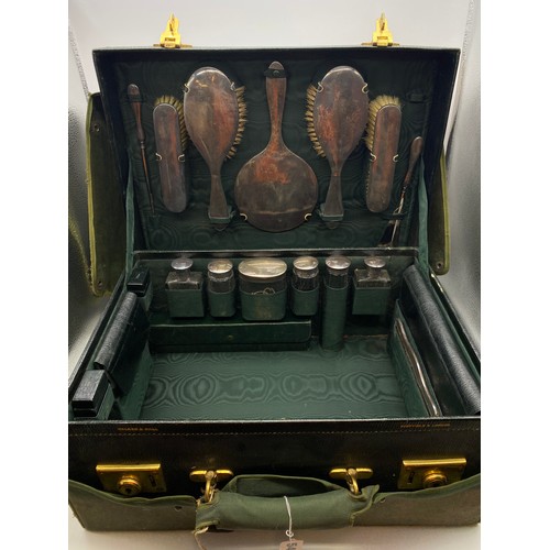 541 - MOROCCAN GREEN LEATHER TRAVELLING VANITY CASE BY WALKER AND HALL FITTED WITH SILVER TOPPED BOTTLES A... 