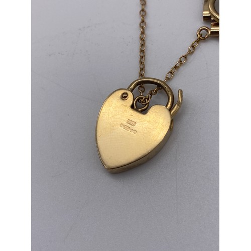 487 - 9CT GOLD THREE GATE BRACELET WITH HEART PADLOCK AND SAFETY CHAIN WITH EXTRA LINK 13.2G