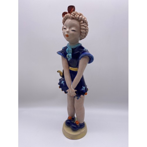 381 - GOLDSCHEIDER POTTERY FIGURE OF THE GIRL WITH RINGLETS IN A BLUE DRESS DESIGNED BY KURT GOEBEL 36cm