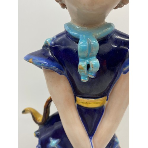 381 - GOLDSCHEIDER POTTERY FIGURE OF THE GIRL WITH RINGLETS IN A BLUE DRESS DESIGNED BY KURT GOEBEL 36cm