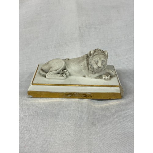 324 - FRENCH DAGOTY PARIS BISCUIT PORCELAIN GILT OUTLINED RECUMBENT LION PAPERWEIGHT, STAMP TO BASE 5cm x ... 