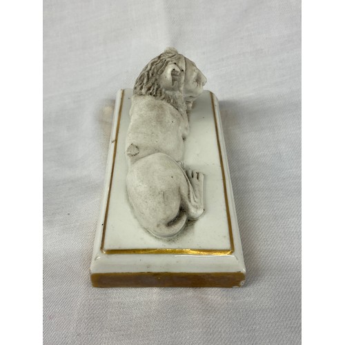 324 - FRENCH DAGOTY PARIS BISCUIT PORCELAIN GILT OUTLINED RECUMBENT LION PAPERWEIGHT, STAMP TO BASE 5cm x ... 