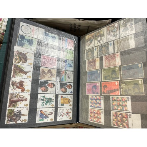 382 - TWO CARTONS OF GB FIRST DAY POSTAGE STAMP COVERS, STAMP ALBUM, AND A TUB OF LOOSE STAMPS