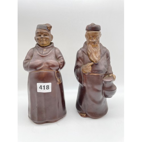 418 - TWO TREACLE GLAZED POTTERY MANDARIN SPIRIT FLASKS