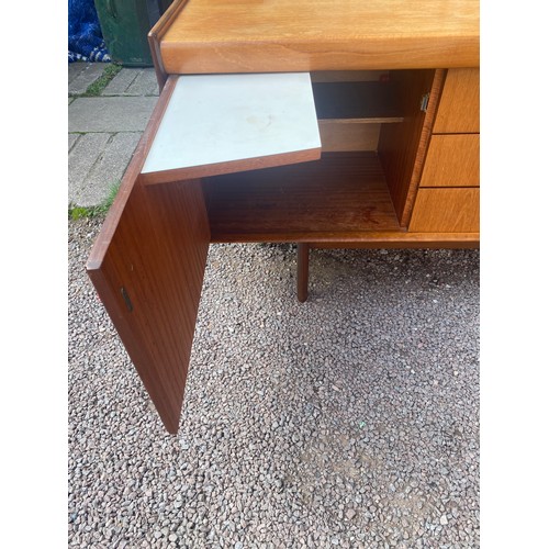 129 - MID 20TH CENTURY LONG TEAK SIDEBOARD WITH PINCHED HANDLES