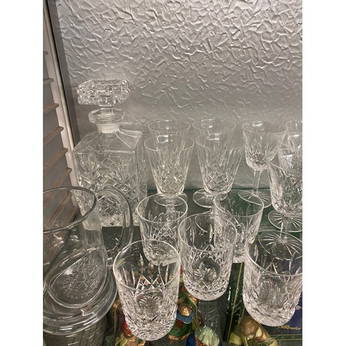 165 - TWO WATERFORD CRYSTAL DECANTERS, TALL WINE GLASSES, FLUTES AND OTHER GOOD QUALITY GLASSWARE AND TUMB... 