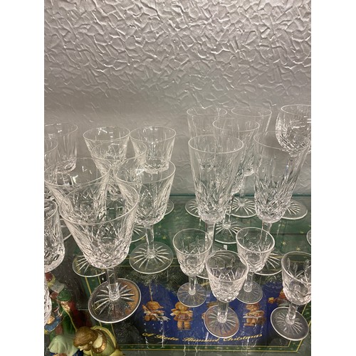 165 - TWO WATERFORD CRYSTAL DECANTERS, TALL WINE GLASSES, FLUTES AND OTHER GOOD QUALITY GLASSWARE AND TUMB... 