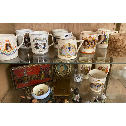 244 - TWO SHELVES OF ROYAL COMMEMORATIVE WARE MUGS AND TANKARDS INCLUDING CROWN DEVON AND PARAGON, ETC.