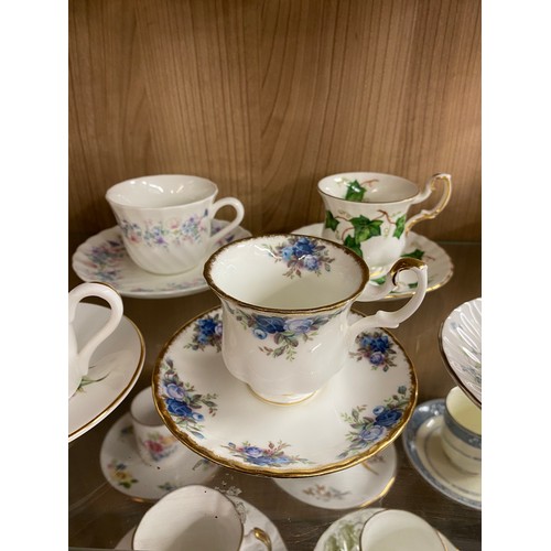 248 - TWO SHELVES OF BONE CHINA CABINET CUPS AND SAUCERS, ROYAL GRAFTON, SPODE, HAMMERSLEY AND OTHERS