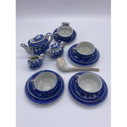 266 - BLUE AND WHITE WILLOW PATTERN DOLLS HOUSE TEA SET AND A CLAY PIPE