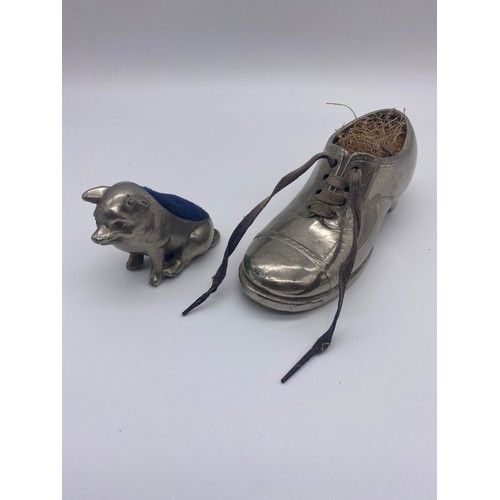 281 - EDWARDIAN SEATED PIG PIN CUSHION AND SHOE PIN CUSHION A/F