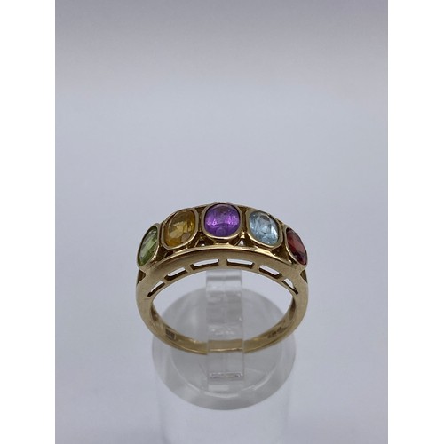 291 - 9CT GOLD MULTI STONE CHANNEL SET RING 3.5G APPROX