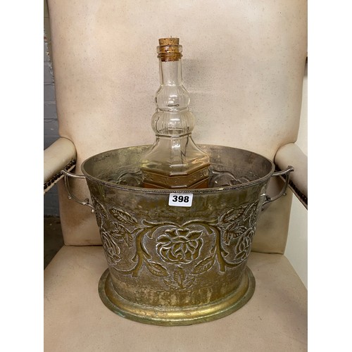 398 - OVAL EMBOSSED TWIN HANDLED BUCKET AND A BOTTLE DECANTER