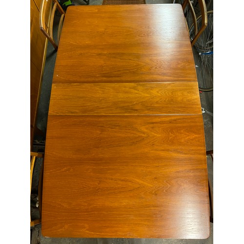 130 - TEAK NARROW DROP FLAP TABLE WITH FOUR MCINTOSH CHAIRS AND AN ELBOW CHAIR