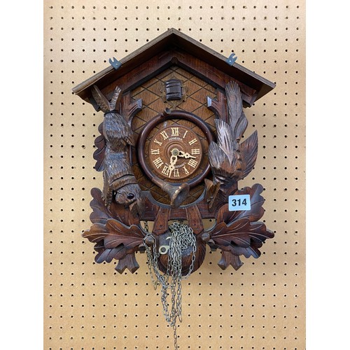 314 - SCHNEIDER CARVED CUCKOO CLOCK WITH PINE CONE WEIGHTS