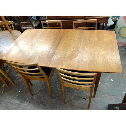 21 - McINTOSH TEAK EXTENDING DINING TABLE AND FOUR CHAIRS