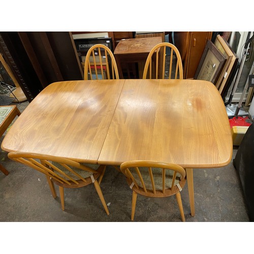 55 - LIGHT ERCOL EXTENDING DINING TABLE WITH FOUR QUAKER BACK WINDSOR CHAIRS (NO.365)