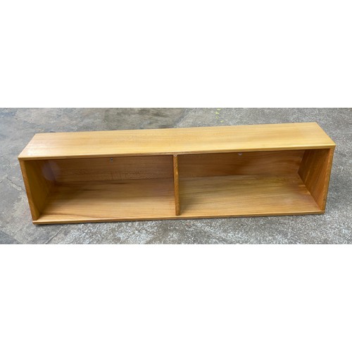 43 - LIGHT ERCOL SLANTED WALL HANGING BOOKSHELF