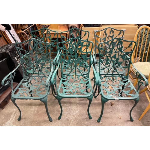 62 - SET OF SIX GREEN PAINTED METAL VINE LEAF BACKED PATIO CHAIRS