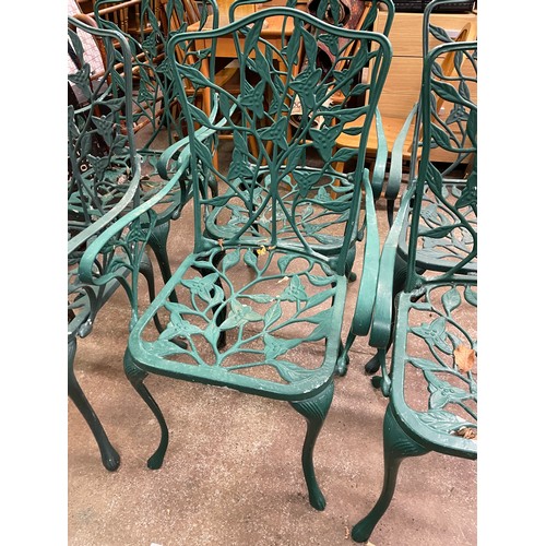 62 - SET OF SIX GREEN PAINTED METAL VINE LEAF BACKED PATIO CHAIRS