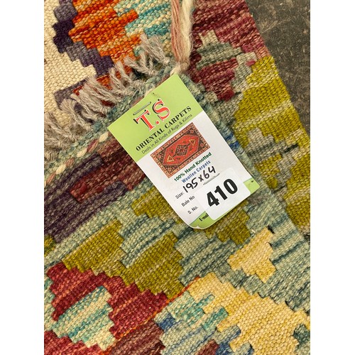 410 - HAND KNOTTED WOOL CARPET WITH MULTI COLOURED GEOMETRIC PATTERN 195CM X 64CM