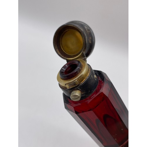 427 - VICTORIAN RUBY GLASS DOUBLE ENDED SCENT BOTTLE AND A RUBY AND OPAQUE TWIST STRETCHER