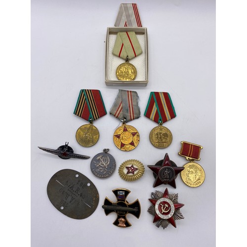 438 - STALINGRAD DEFENCE MEDAL, DOG TAG AND ASSORTED INSIGNIA