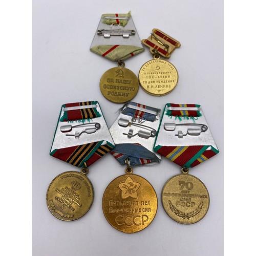 438 - STALINGRAD DEFENCE MEDAL, DOG TAG AND ASSORTED INSIGNIA