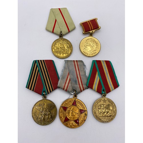 438 - STALINGRAD DEFENCE MEDAL, DOG TAG AND ASSORTED INSIGNIA