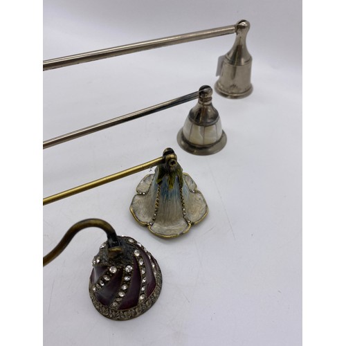 449 - FOUR ENAMEL AND MOTHER OF PEARL EFFECT AND PLAIN METAL CANDLE SNUFFERS