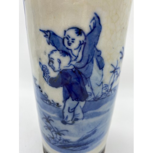 469 - PAIR OF CHINESE CRACKLE GLAZED BLUE AND WHITE SLEEVE VASES DECORATED WITH FIGURES