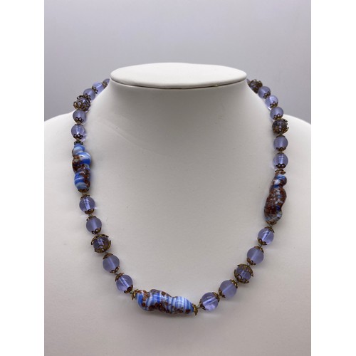 502 - AQUA COLOURED GLASS BALL BEAD NECKLACE, ONE OTHER GLITTER DECORATED STRAND AND AMBER TYPE NECKLACES