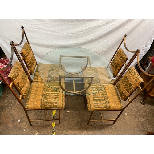 107 - INCA METAL FRAMED CIRCULAR GLASS TOP DINING TABLE AND FOUR EGYPTIAN THEME UPHOLSTERED DINING CHAIRS