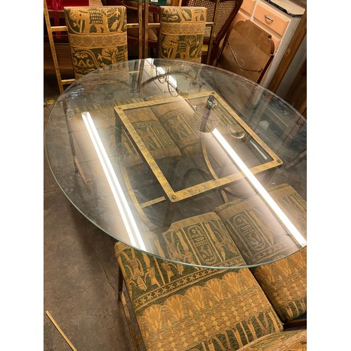 107 - INCA METAL FRAMED CIRCULAR GLASS TOP DINING TABLE AND FOUR EGYPTIAN THEME UPHOLSTERED DINING CHAIRS