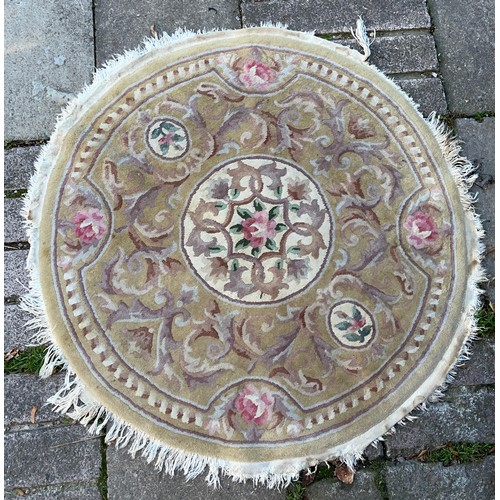 103 - TWO WASH WOOLEN RUGS 125CM DIAMETER