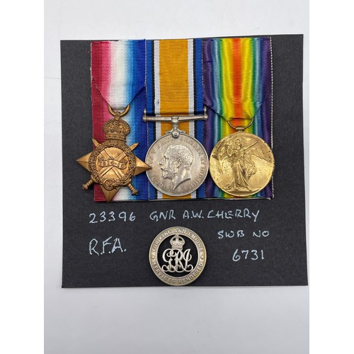 412 - WWI MEDAL TRIO 23396 GNR A.W.CHERRY RFA, SWB 6731, FOR KING AND EMPIRE SERVICE LAPEL BADGE