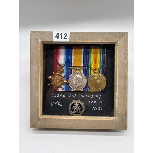 412 - WWI MEDAL TRIO 23396 GNR A.W.CHERRY RFA, SWB 6731, FOR KING AND EMPIRE SERVICE LAPEL BADGE