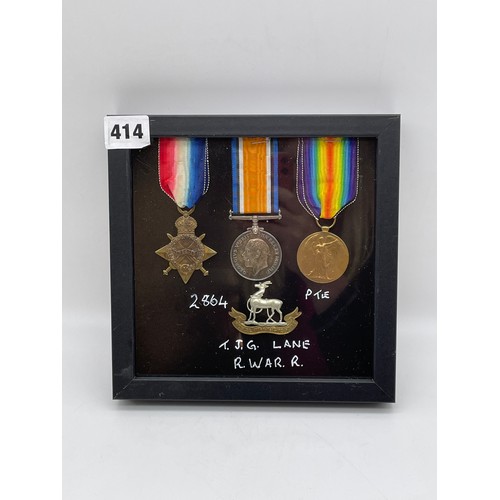 414 - WWI MEDAL TRIO 2864 PTE T.J.G.LANE R.WAR.R AND WITH CAP BADGE