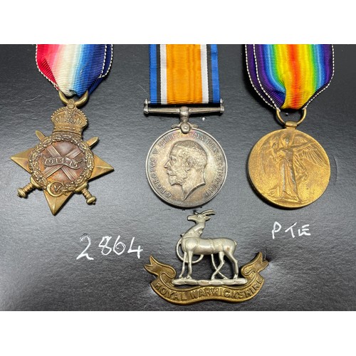 414 - WWI MEDAL TRIO 2864 PTE T.J.G.LANE R.WAR.R AND WITH CAP BADGE