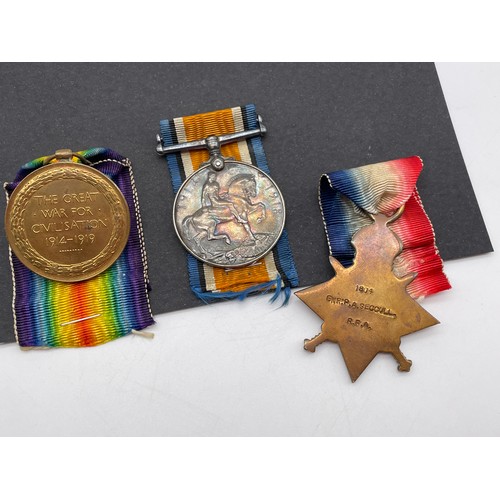 404 - MILITARY MONS STAR 1914 TRIO MEDAL GROUP 1804 GNR P.A.SECCULL R.F.A IN CASE