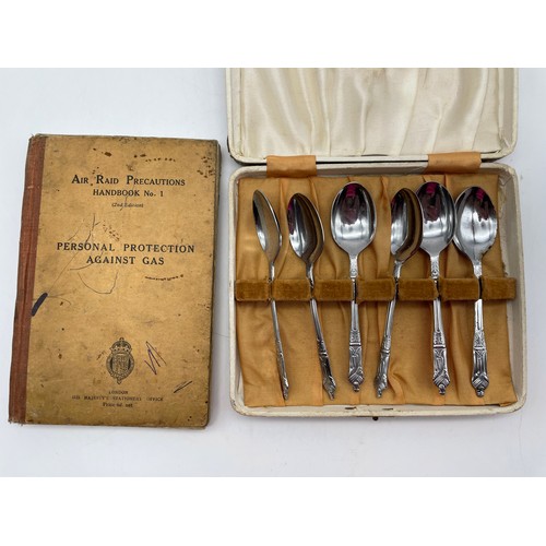 530 - SILVER ARP BADGE AND AIR RAID PRECAUTIONS HANDBOOK NUMBER ONE, AND CASE OF SMALL TEASPOONS