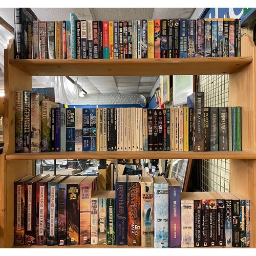 519 - THREE SHELVES OF HARDBACK AND MAINLY PAPER BACK SCIENCE FICTION AND FANTASY NOVELS INCLUDING ALAN DE... 