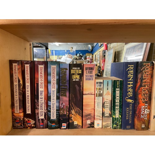 519 - THREE SHELVES OF HARDBACK AND MAINLY PAPER BACK SCIENCE FICTION AND FANTASY NOVELS INCLUDING ALAN DE... 