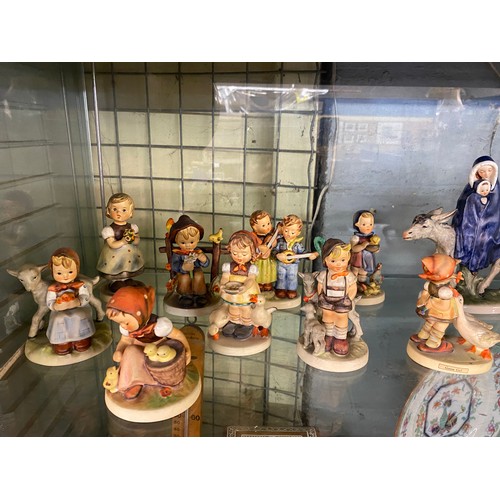551 - SHELF OF GOEBEL FIGURES INC. 1959 MARY AND JESUS ON DONKEY, GOOSE GIRL, CHICK GIRL AND A DOULTON AND... 